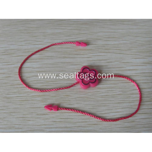 Pink paper tags with string